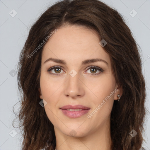 Joyful white adult female with long  brown hair and brown eyes