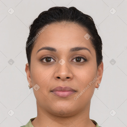 Joyful latino young-adult female with short  brown hair and brown eyes