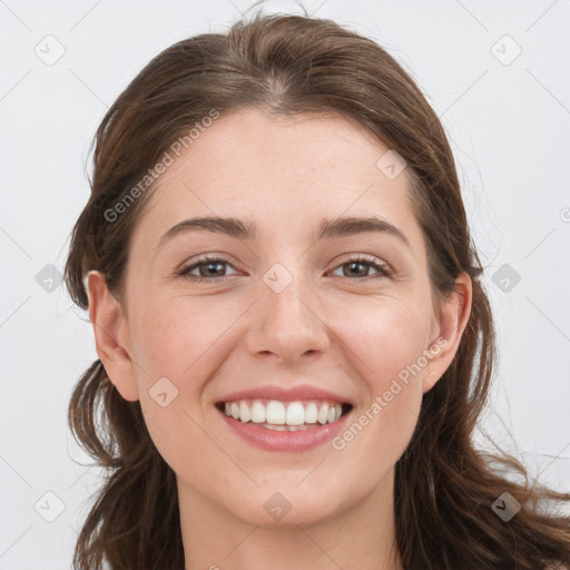 Joyful white young-adult female with long  brown hair and grey eyes