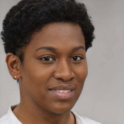 Joyful black young-adult female with short  brown hair and brown eyes