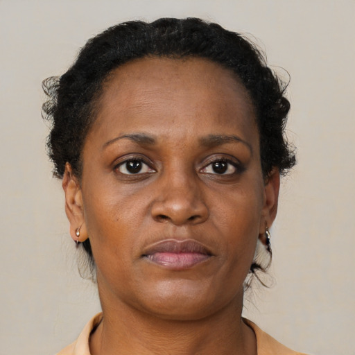 Neutral black adult female with short  brown hair and brown eyes