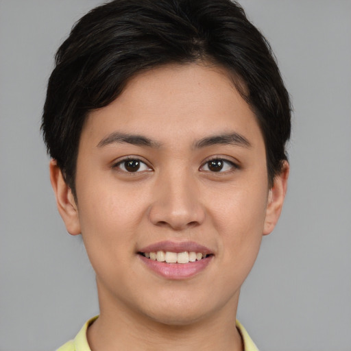 Joyful asian young-adult female with short  brown hair and brown eyes