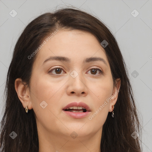 Joyful white young-adult female with long  brown hair and brown eyes