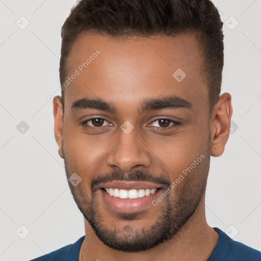 Joyful white young-adult male with short  brown hair and brown eyes