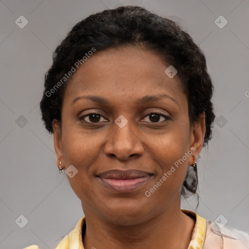Joyful black adult female with short  brown hair and brown eyes