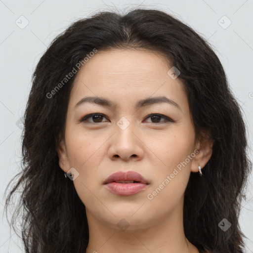 Joyful latino young-adult female with long  brown hair and brown eyes