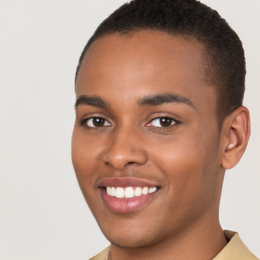 Joyful black young-adult male with short  brown hair and brown eyes