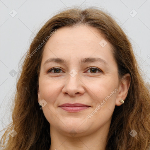 Joyful white adult female with long  brown hair and brown eyes