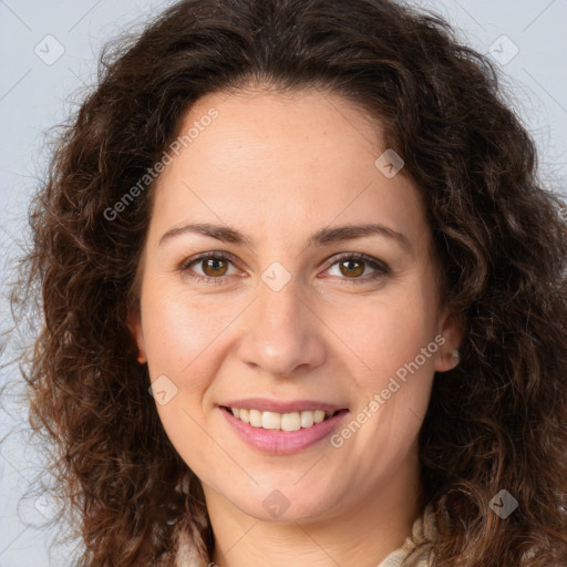 Joyful white adult female with long  brown hair and brown eyes