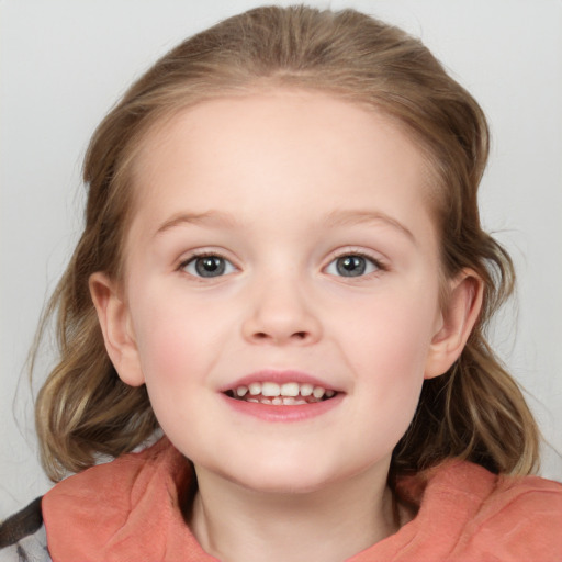 Joyful white child female with medium  brown hair and blue eyes