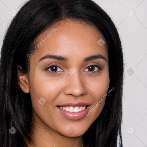 Joyful latino young-adult female with long  brown hair and brown eyes