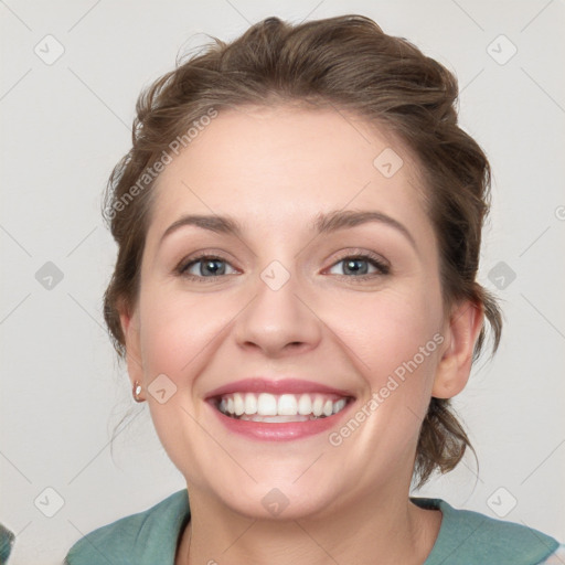 Joyful white young-adult female with medium  brown hair and blue eyes