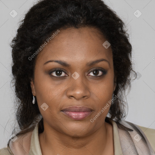 Joyful black young-adult female with long  brown hair and brown eyes