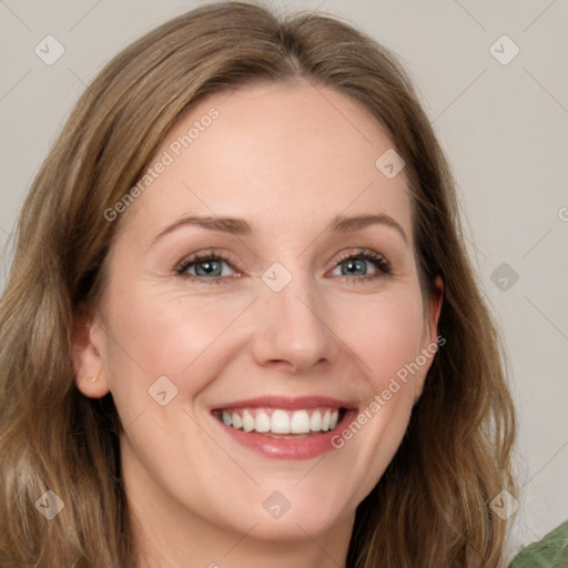 Joyful white young-adult female with long  brown hair and green eyes