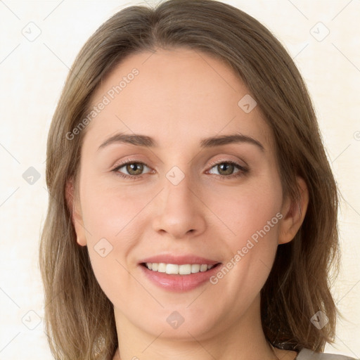 Joyful white young-adult female with medium  brown hair and green eyes