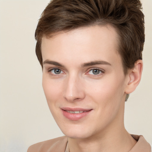 Joyful white young-adult female with short  brown hair and grey eyes