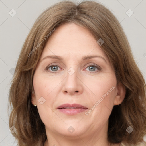 Joyful white adult female with medium  brown hair and grey eyes