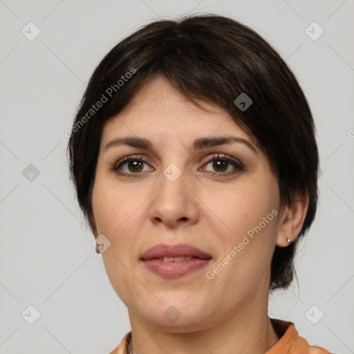 Joyful white adult female with medium  brown hair and brown eyes