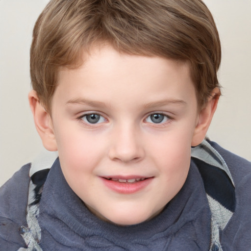 Joyful white child male with short  brown hair and grey eyes