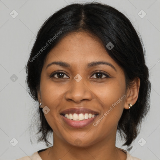 Joyful black young-adult female with medium  black hair and brown eyes