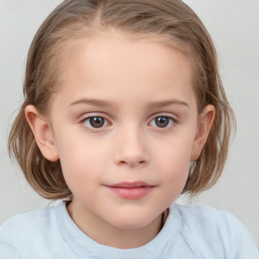 Joyful white child female with medium  brown hair and blue eyes