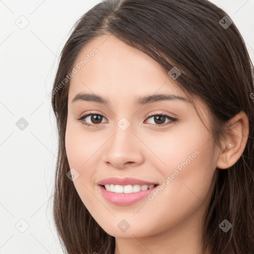 Joyful white young-adult female with long  brown hair and brown eyes