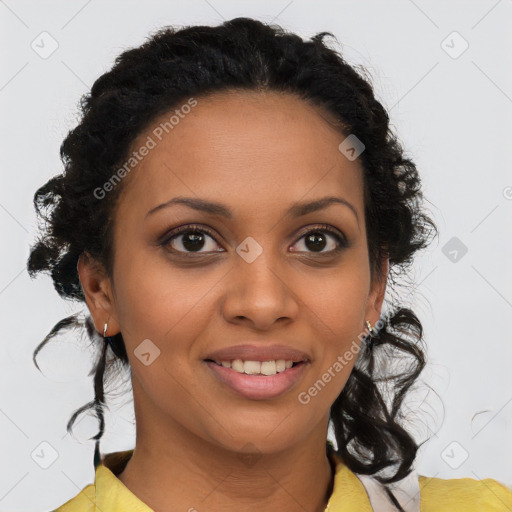 Joyful black young-adult female with medium  brown hair and brown eyes