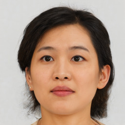 Neutral asian young-adult female with medium  brown hair and brown eyes