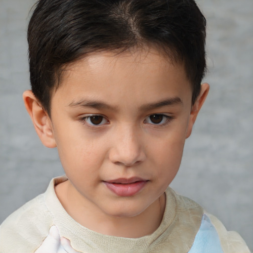 Joyful white child female with short  brown hair and brown eyes