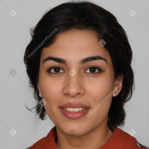 Joyful latino young-adult female with medium  brown hair and brown eyes