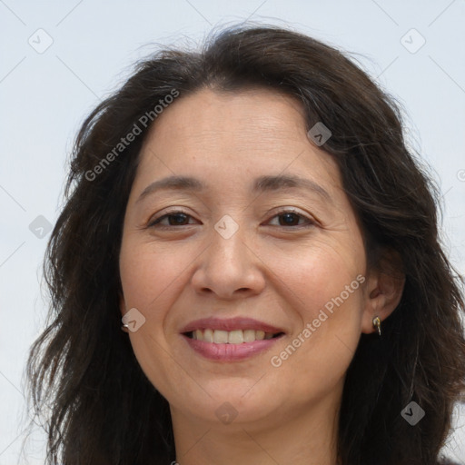 Joyful white adult female with long  brown hair and brown eyes