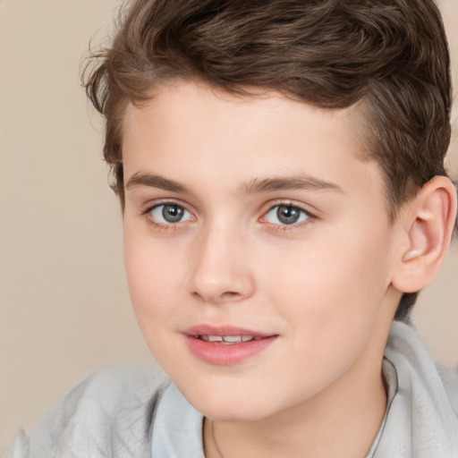 Joyful white child male with short  brown hair and brown eyes