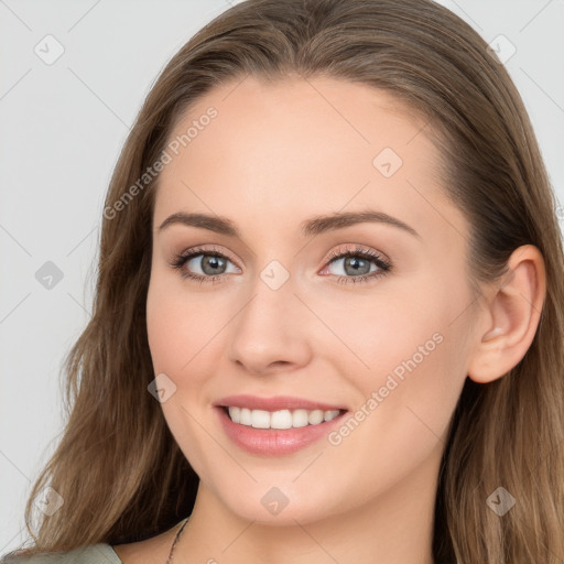 Joyful white young-adult female with long  brown hair and blue eyes