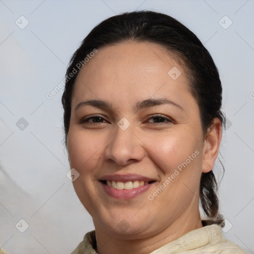 Joyful white adult female with medium  brown hair and brown eyes