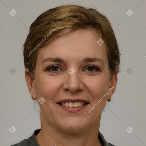 Joyful white adult female with short  brown hair and brown eyes