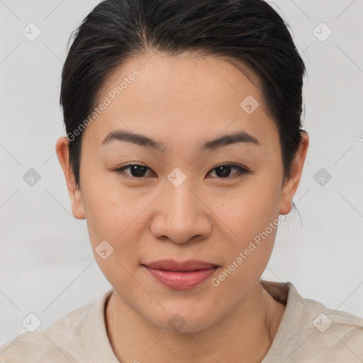 Joyful asian young-adult female with short  brown hair and brown eyes