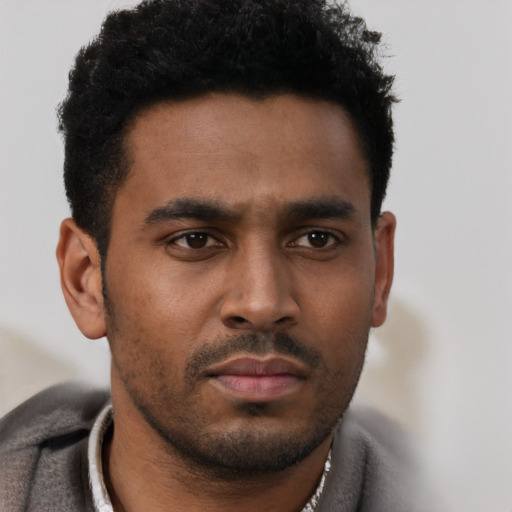 Neutral black young-adult male with short  black hair and brown eyes