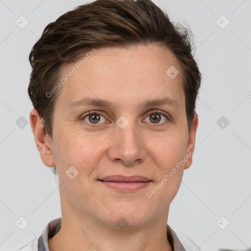 Joyful white adult female with short  brown hair and brown eyes