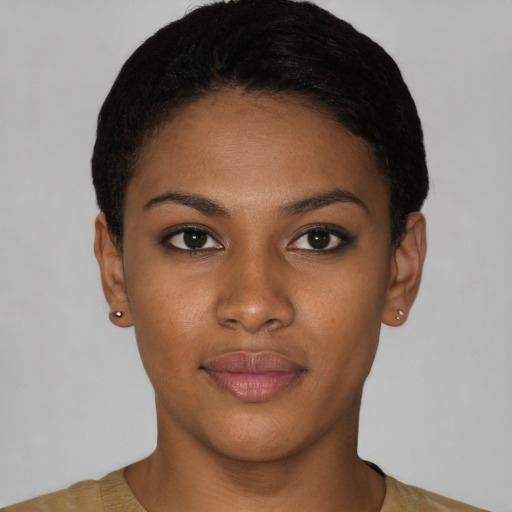 Joyful latino young-adult female with short  black hair and brown eyes