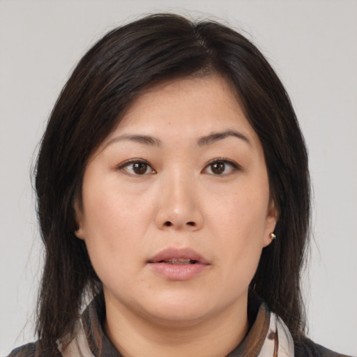 Neutral asian young-adult female with medium  brown hair and brown eyes