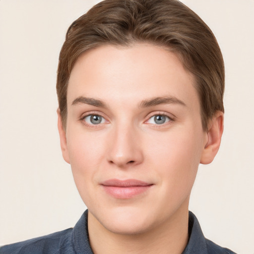 Joyful white young-adult female with short  brown hair and grey eyes