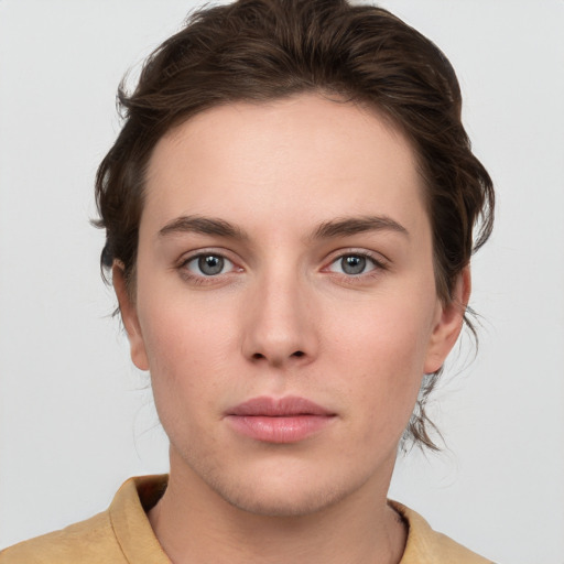 Neutral white young-adult female with medium  brown hair and grey eyes