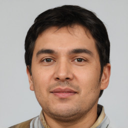 Neutral white young-adult male with short  black hair and brown eyes