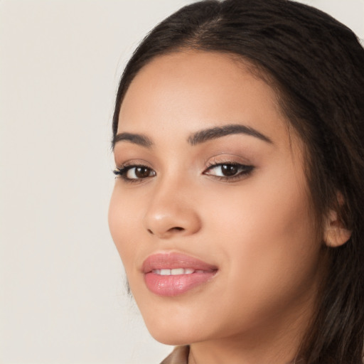 Joyful white young-adult female with long  black hair and brown eyes