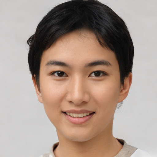 Joyful asian young-adult female with short  black hair and brown eyes