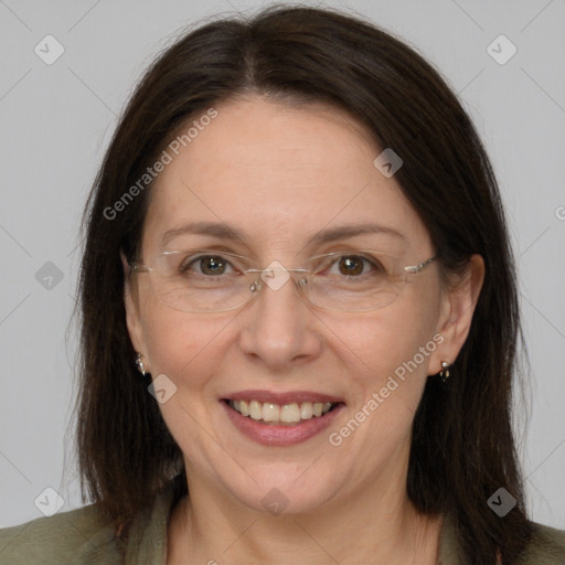 Joyful white adult female with medium  brown hair and grey eyes