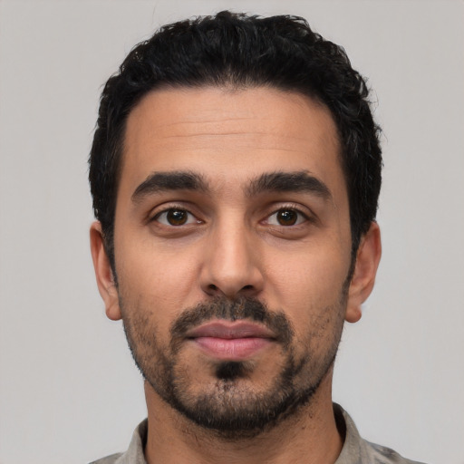 Neutral latino young-adult male with short  black hair and brown eyes