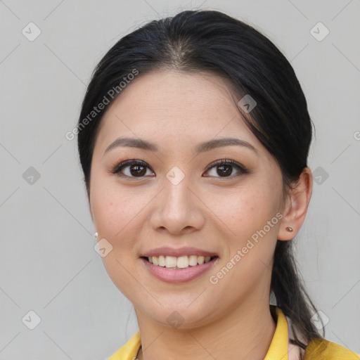 Joyful asian young-adult female with medium  brown hair and brown eyes