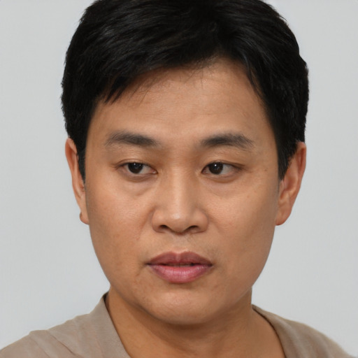Neutral asian young-adult male with short  black hair and brown eyes