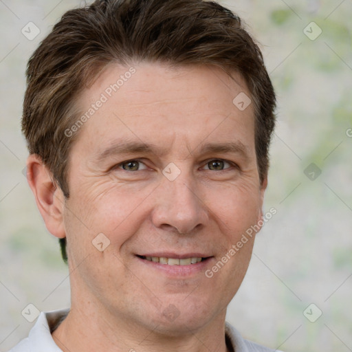 Joyful white adult male with short  brown hair and grey eyes